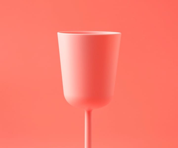 A red cup in a reddish background